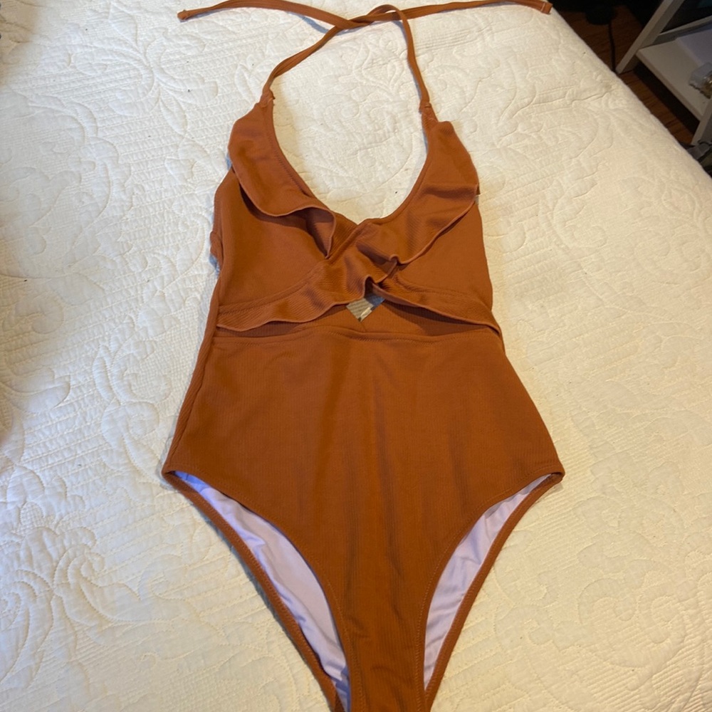 Rust colored one piece halter bathing suit with ruffle